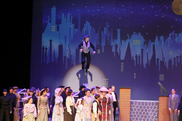 Senior Jordan Smaka rises above the cast of Mary Poppins. The was the first show in Grand Haven Theater Department history to include an element of theater such as flight which made for a very visually appealing play.