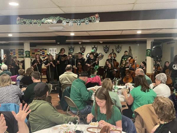 GOTAK prepares to perform at the American Legion.  Saint Patricks day is kind of our thing Melissa Meyers said to the crowd before starting. 