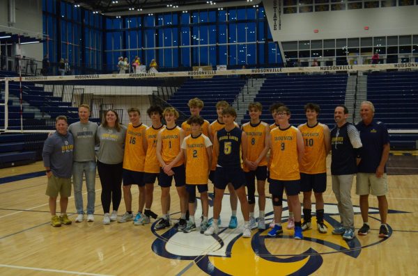 The Boys Volleyball team lines up for photos after winning their state semifinals match and moving onto the finals. The Bucs will be playing against Hudsonville for the third year in a row.