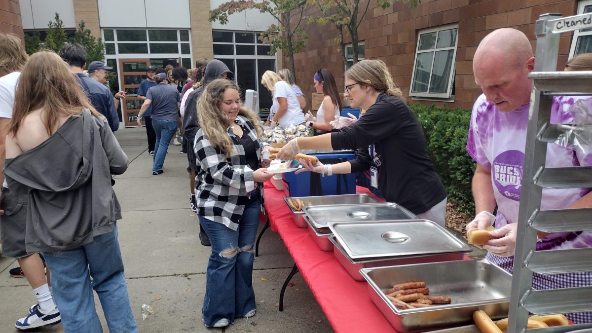 Lunch today featured a hot dog bar for all students, each student got one for free and all subsequent were $1/per. School administration operated the grill while other staff served.