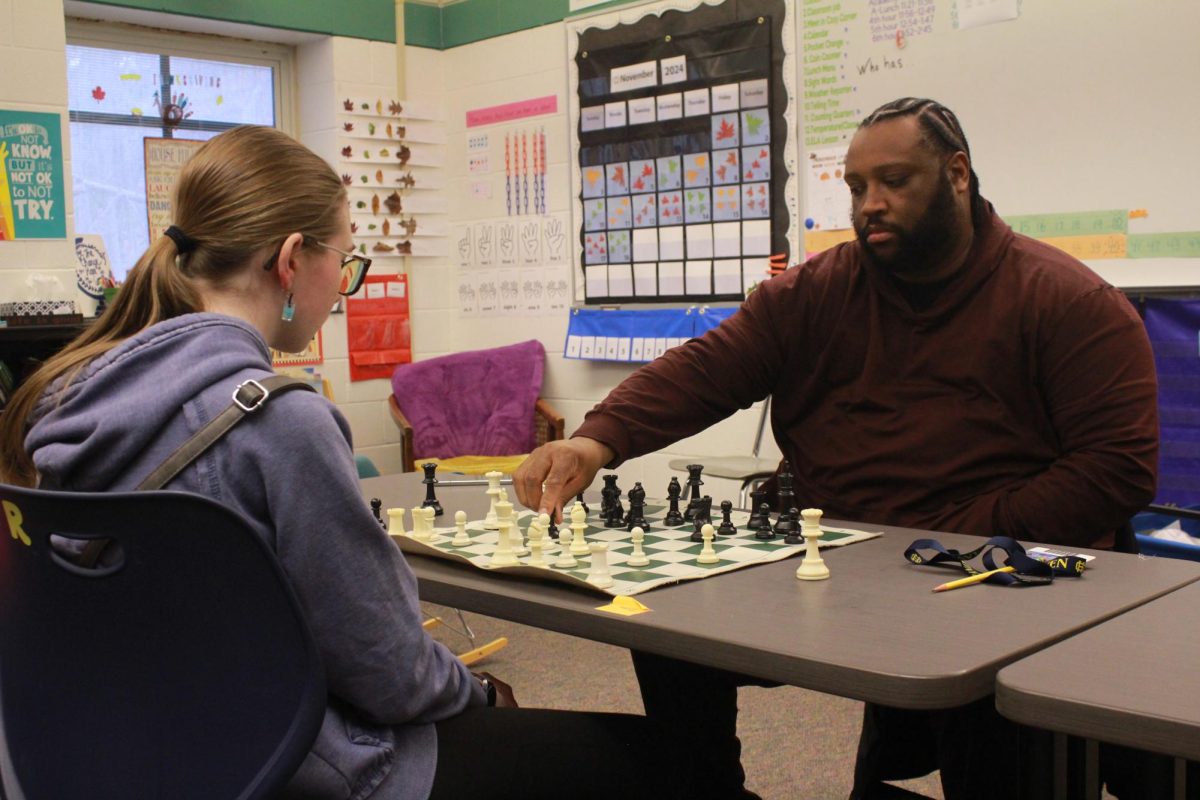 Sophomore Annikha Esnaola faces off with SXI Thomas Evans at Chess Club. The club, restarted by teacher Dan Sears, had it's first meeting on Monday, Nov. 18 and is scheduled to meet every Monday.