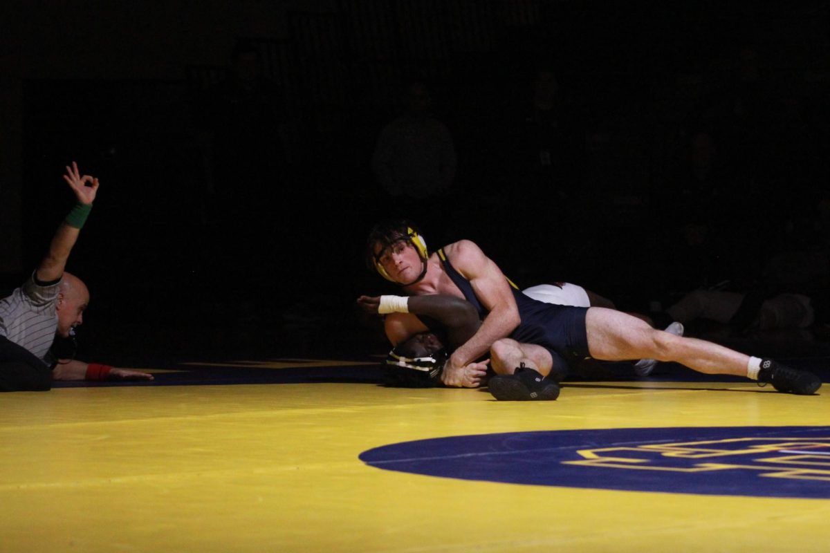 Senior Wyatt Sieniarecki pins opponent Emmanuel Hertzler in 0:30 at the home Varsity Wrestling match on Friday, Dec. 20. Grand Haven won the match over Hart Highschool 37-36.