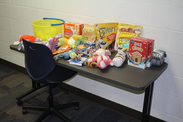 The donation table for Operation Santa Paws. For more information about how you can donate, see Mr. Wiebenga in room 3113.