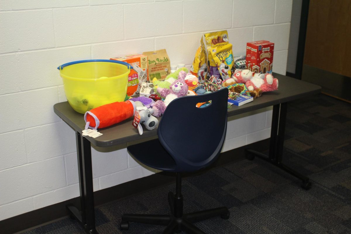 The donation table located outside of room 3113. Operation Santa Paws is open and currently accepting donations.