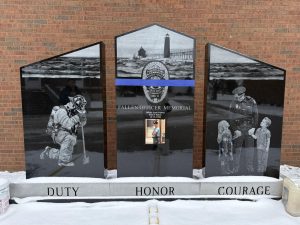 A memorial dedicated to Officer Scott Flahive located to the left of the entrance to the Grand Haven Department of Public Safety building. A memorial service is held here every year on the anniversary of Officer Flahive's death.